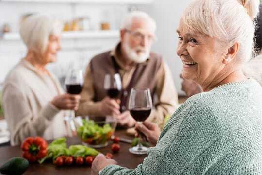 resident with glass of wine